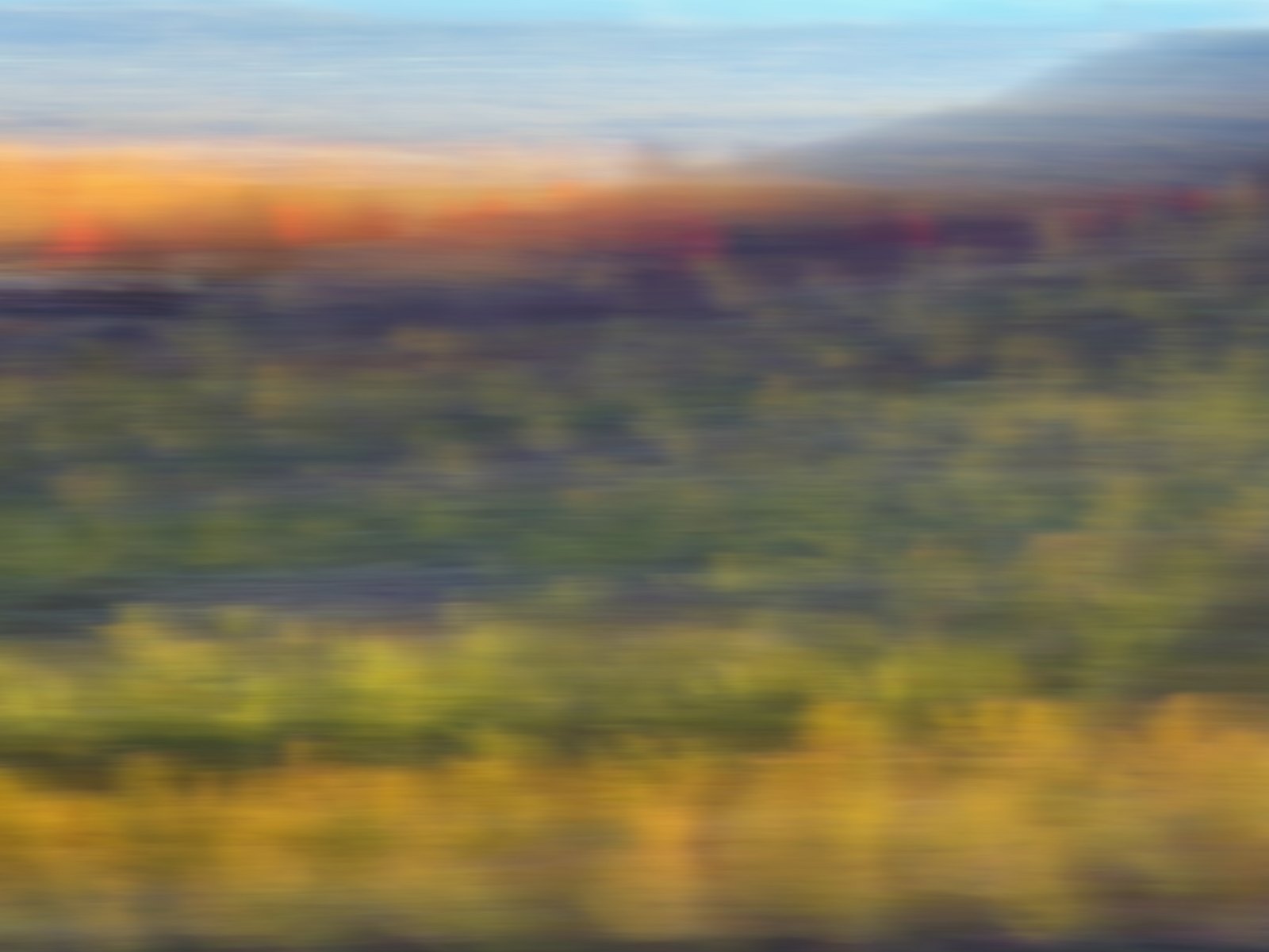 Image A, a motion-blurred autumn landscape