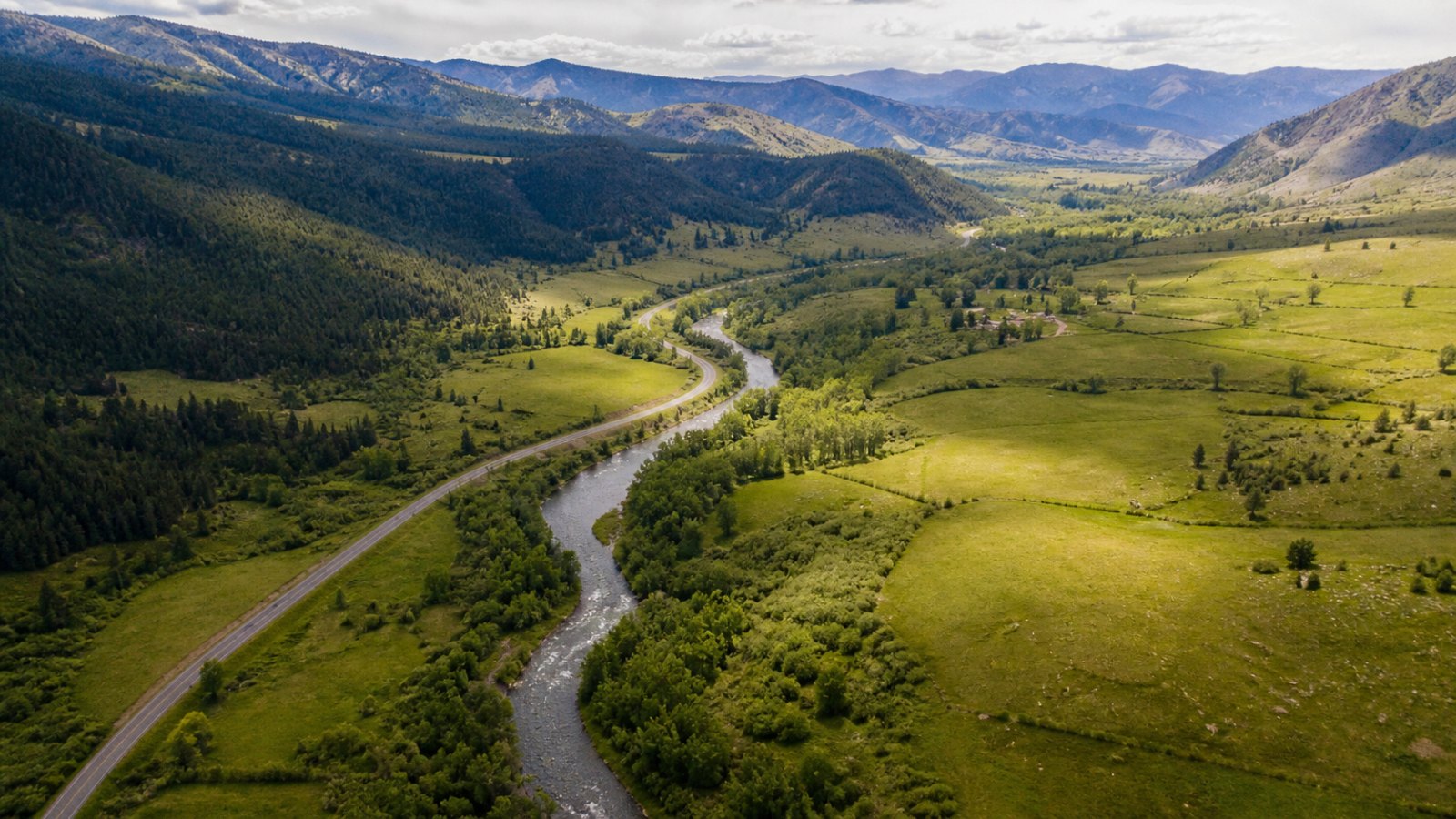 Image D, an aerial of a river winding through a green valley