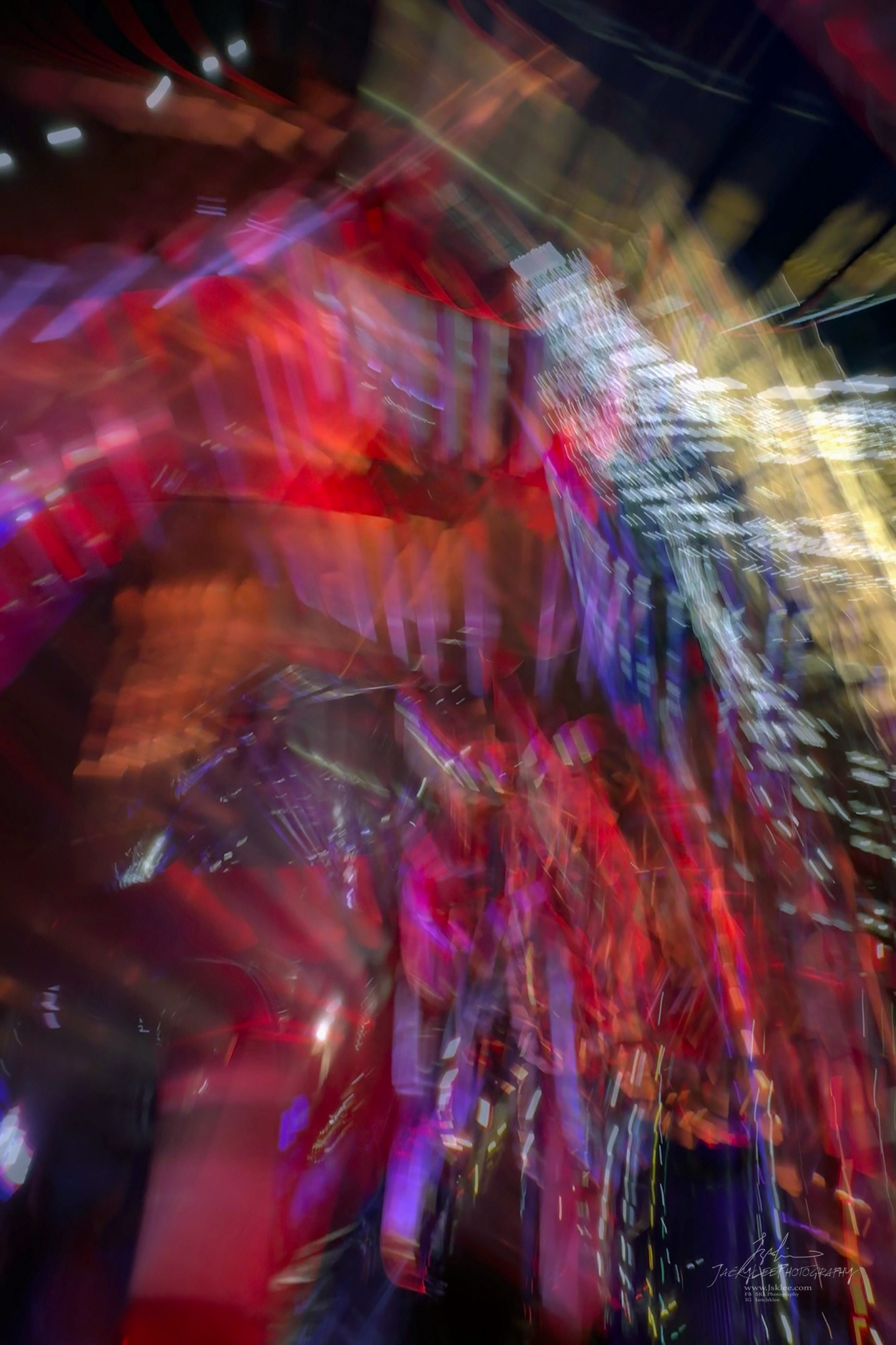 Red and gold signage drawn into overlapping light strokes, The Awakening, the first frame of Dragon of Light, an Intentional Camera Movement photograph made at Vivid Sydney by Jacky Lee